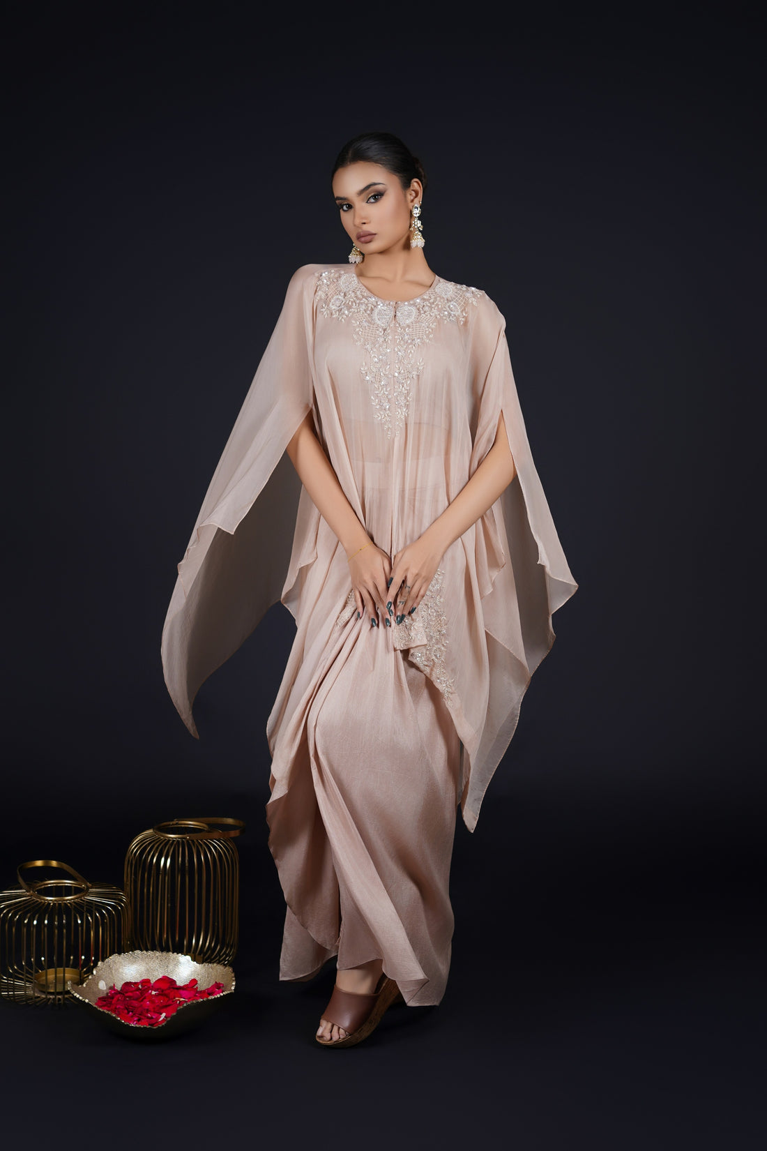 Ash Rose Pink organza cape paired with a drape skirt and crop top, embellished with pearls, sequins, and cutdana embroidery - Perfect for festive and formal events.