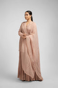Ash rose pink sharara suit featuring an angrakha-style kurta with lapel collar, intricate zardozi, kasab, pearl, and sequin work, paired with pleated sharara pants and an organza dupatta for a timeless festive look.