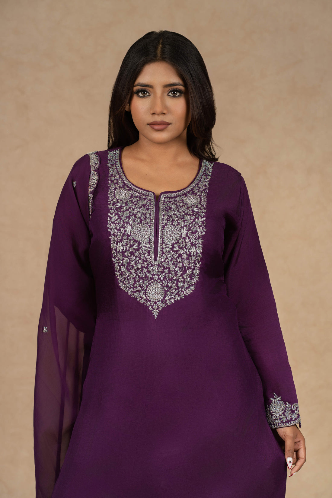 Elegant purple embroidered kurta set featuring intricate silver threadwork, paired with matching palazzo pants and a chiffon dupatta, perfect for festive and formal occasions.