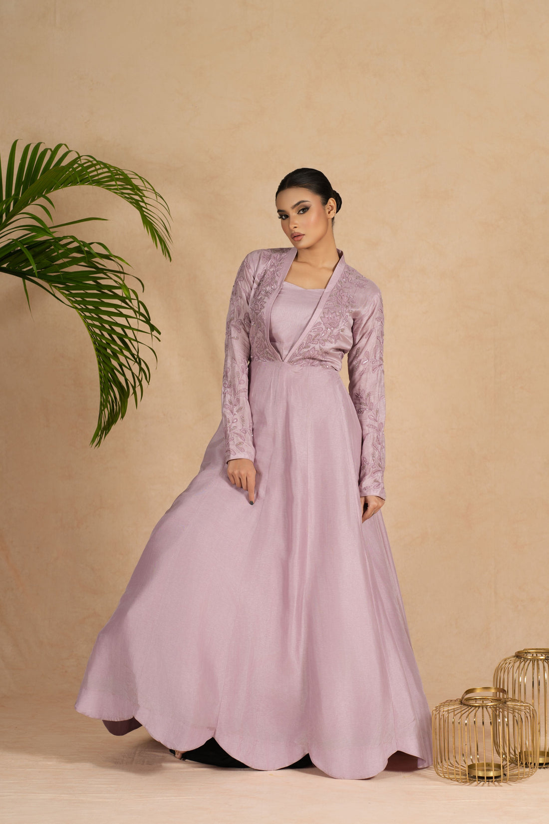 Lavender Indowestern with a bustier featuring intricate pearl, kasab, sequin, and applique embellishments on the bodice and full sleeves, ideal for weddings and festive occasions.