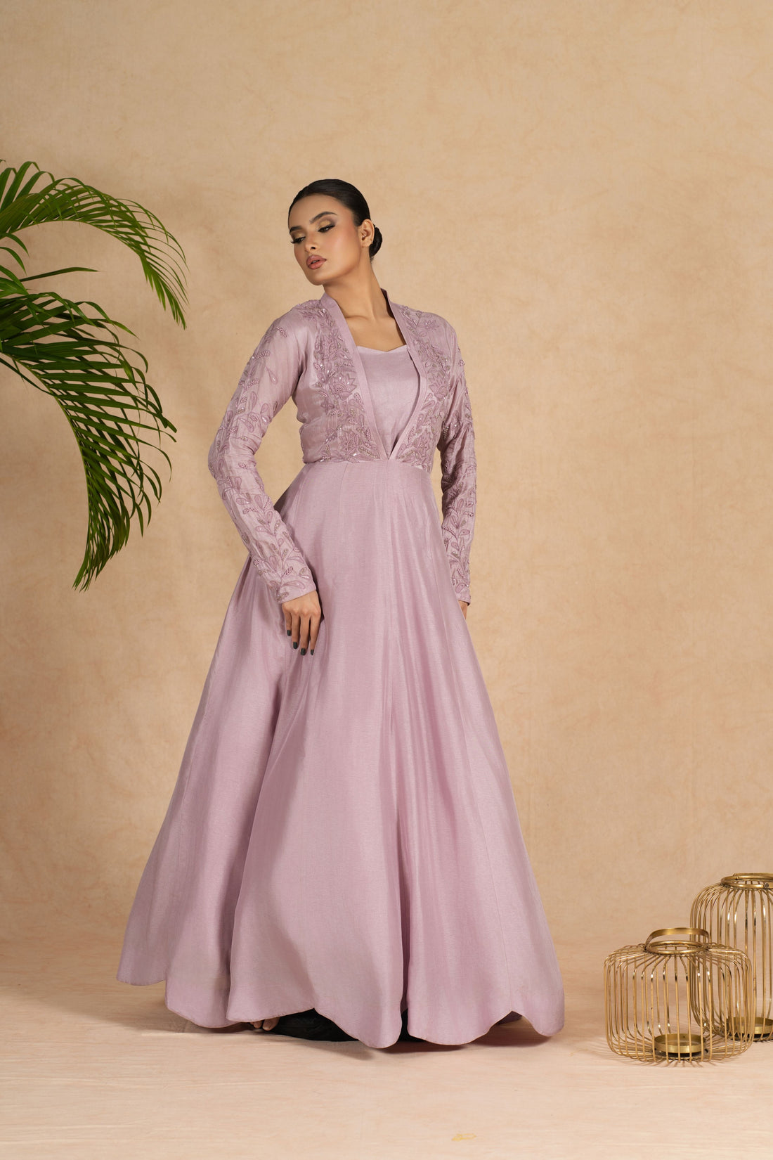 Lavender Indowestern with a bustier featuring intricate pearl, kasab, sequin, and applique embellishments on the bodice and full sleeves, ideal for weddings and festive occasions.