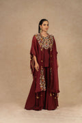 Maroon organza Indo-Western kurta set with intricate Dori, sequins, pearls, and thread embellishments, paired with matching flowy palazzo pants, perfect for festive and formal occasions.