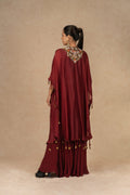 Maroon organza Indo-Western kurta set with intricate Dori, sequins, pearls, and thread embellishments, paired with matching flowy palazzo pants, perfect for festive and formal occasions.