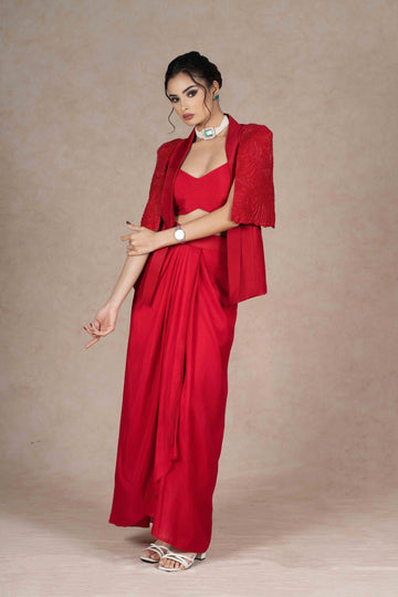 Cherry red jacket, bustier, and pre-draped skirt with hand-beaded cape sleeves. Lightweight, stylish, and perfect for festive, wedding, or formal occasions.