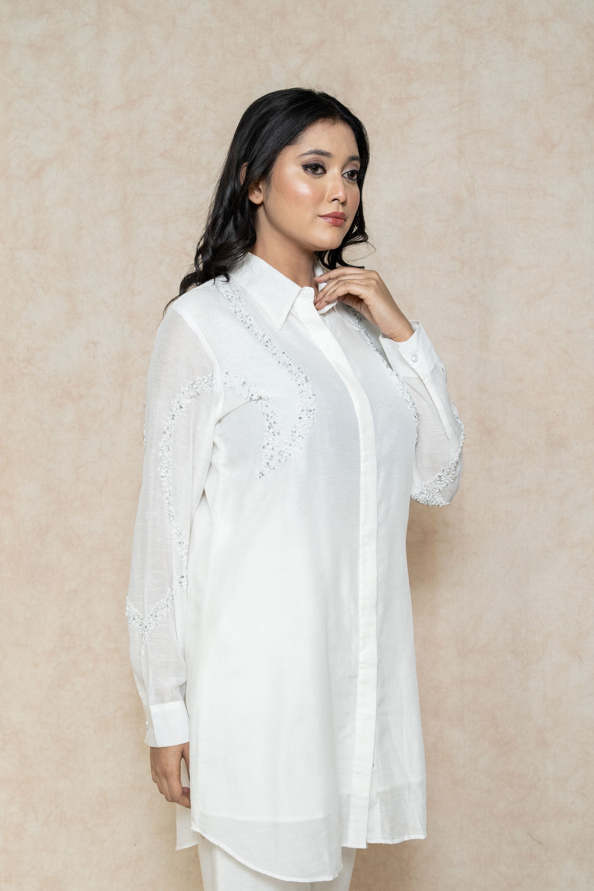 closeup-side-view-white-kurta-set-for-women-with-beadwork