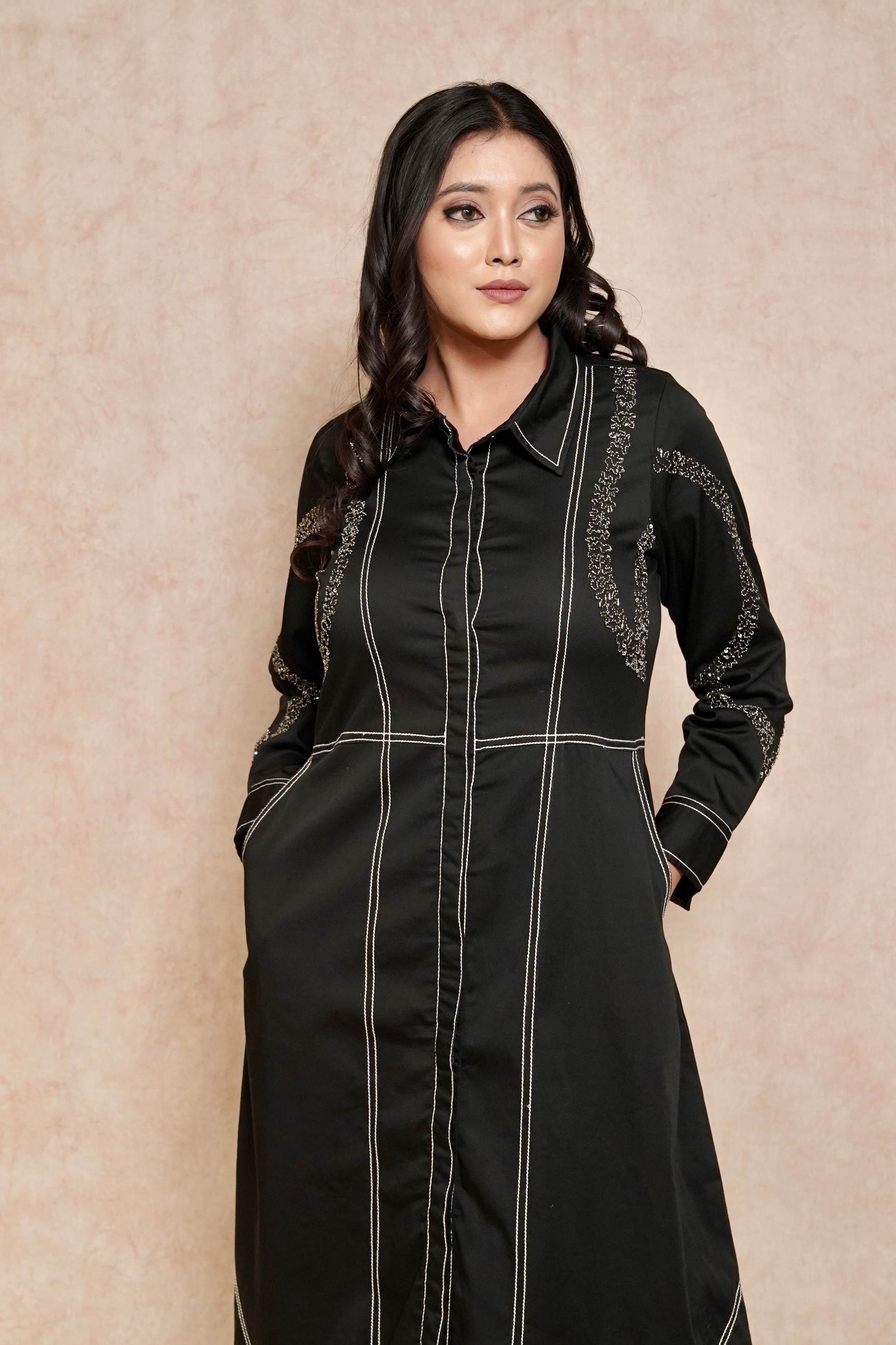 closeup-view-elegant-black-dress-contrasting-stitch-embellished-sleeves