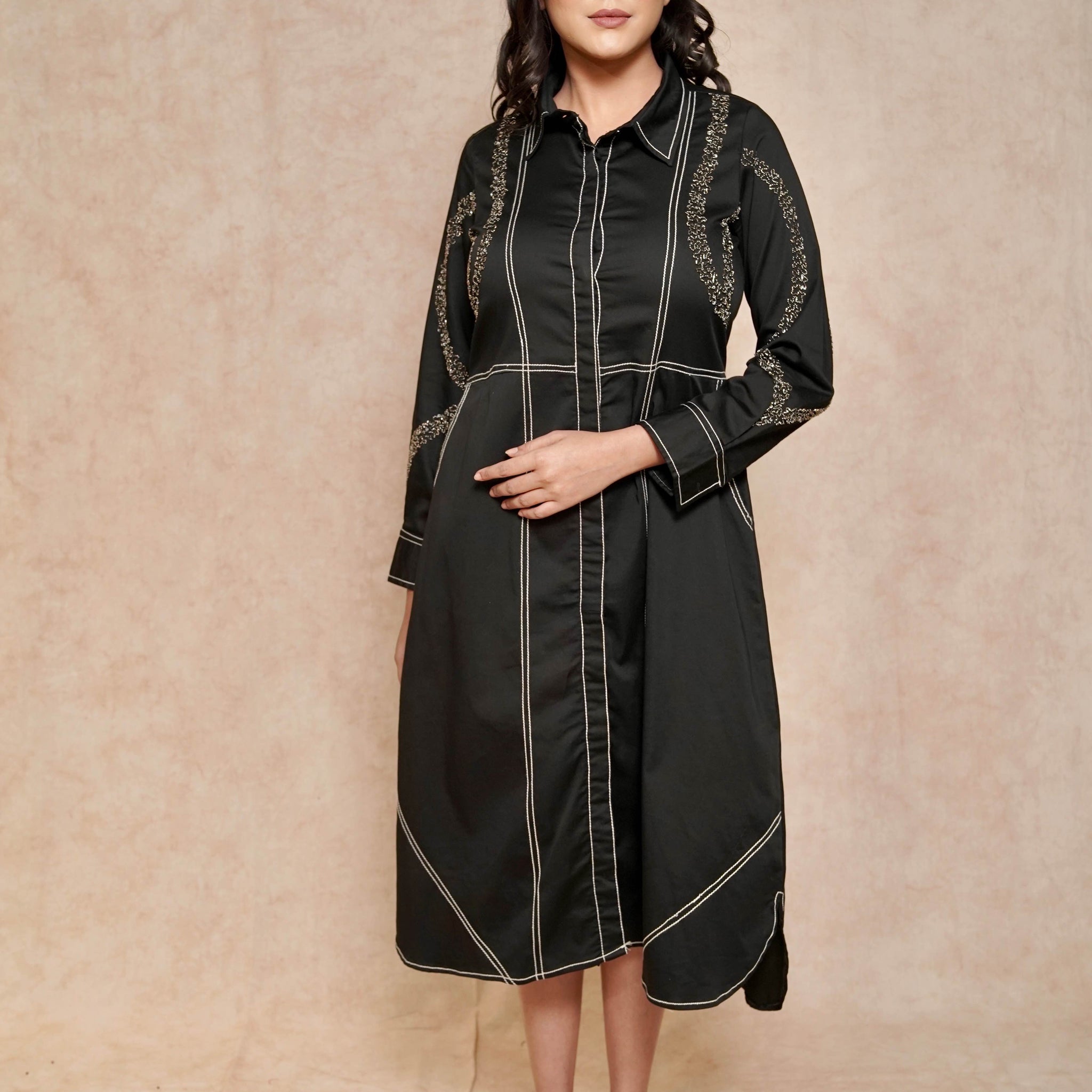 front-view-elegant-black-dress-contrasting-stitch-embellished-sleeves