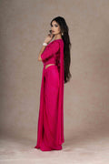 Fuchsia ready-to-wear drape saree with embellished blouse and tie-up belt, crafted in lightweight crepe fabric for a stylish and comfortable festive look.