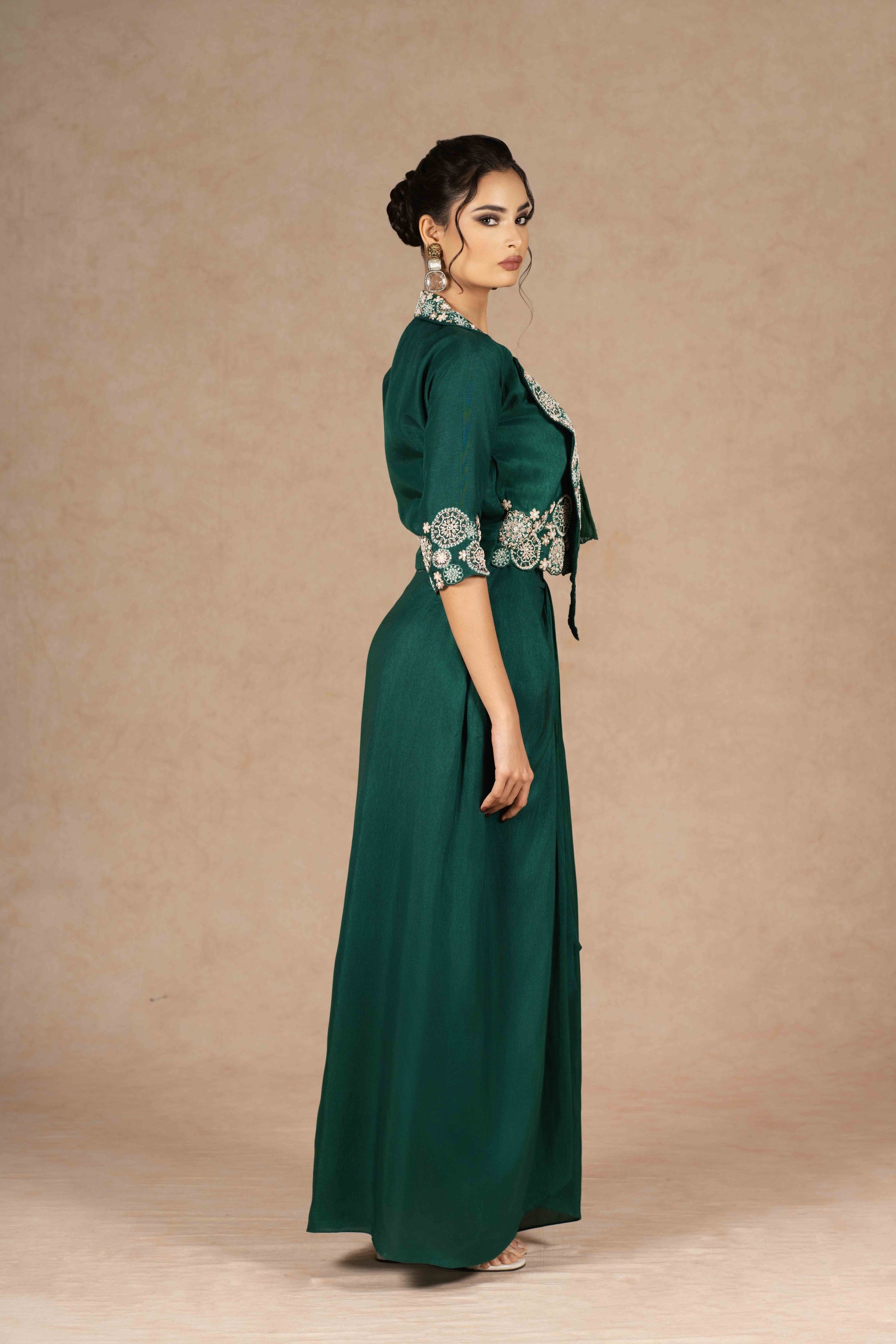 Side profile view of the Indo-Western Jacket Dress with a draped skirt, showcasing the elegant silhouette and embroidered accents.