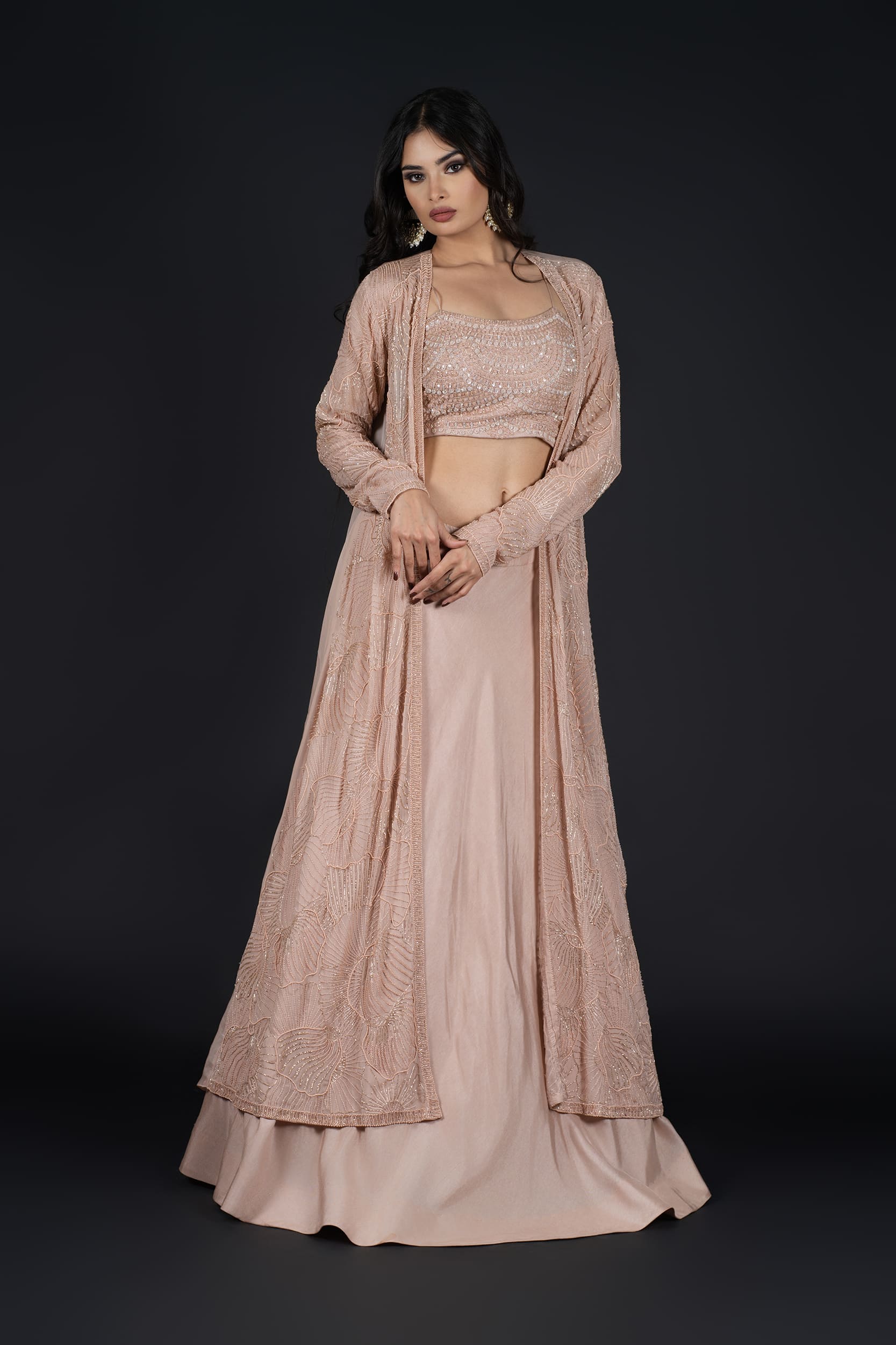 A timeless and sophisticated look in a blush pink Indo-Western Skirt with a long jacket, ideal for festive and formal events.