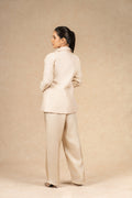 Rear view of the Ivory Silk Blazer set, showing a clean, minimalistic design with a smooth silk finish and structured tailoring.