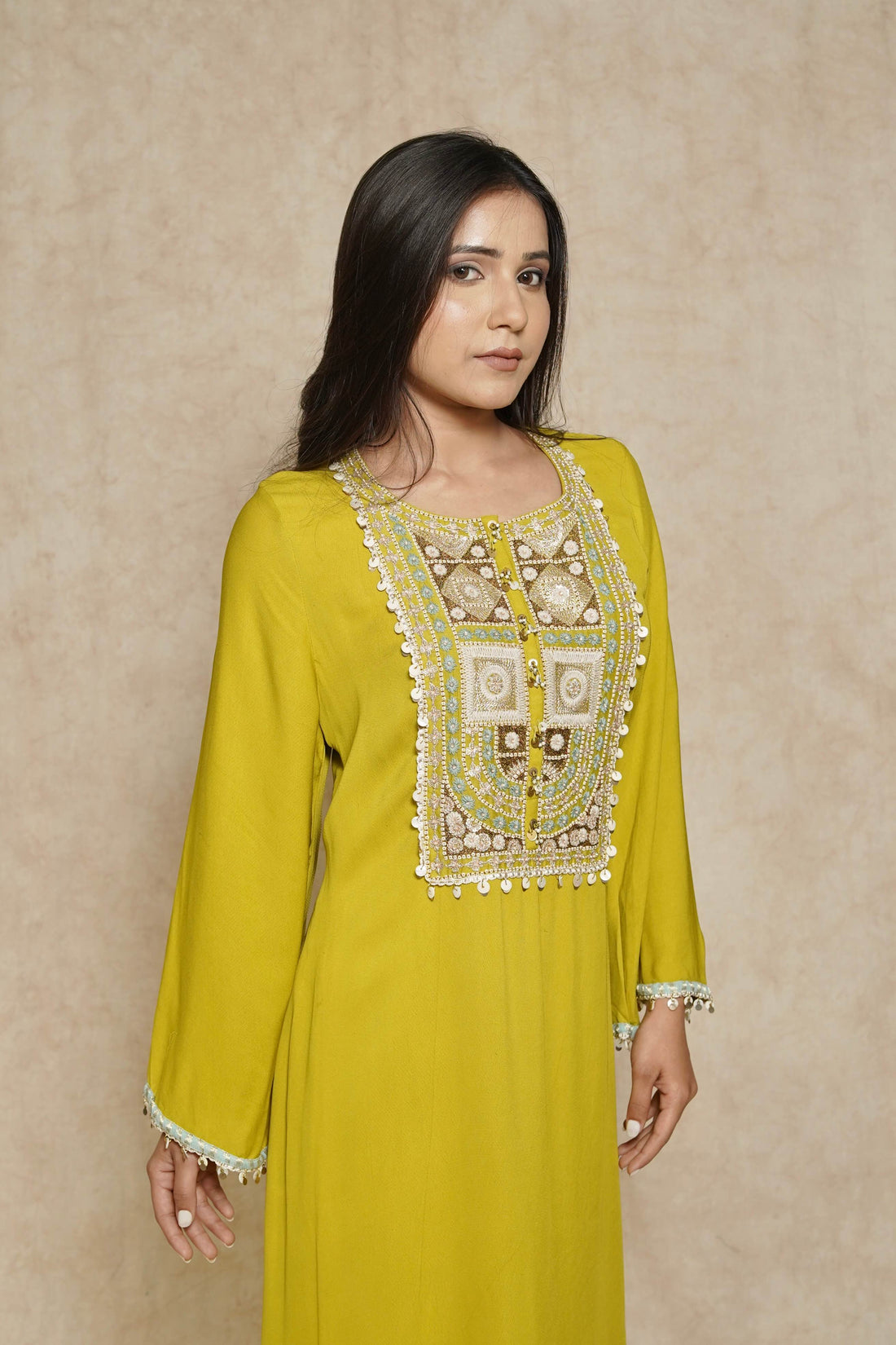 Model wearing a lime green kurta set for women, featuring intricate embroidery and bell sleeves – a perfect festive kurta and palazzo set.