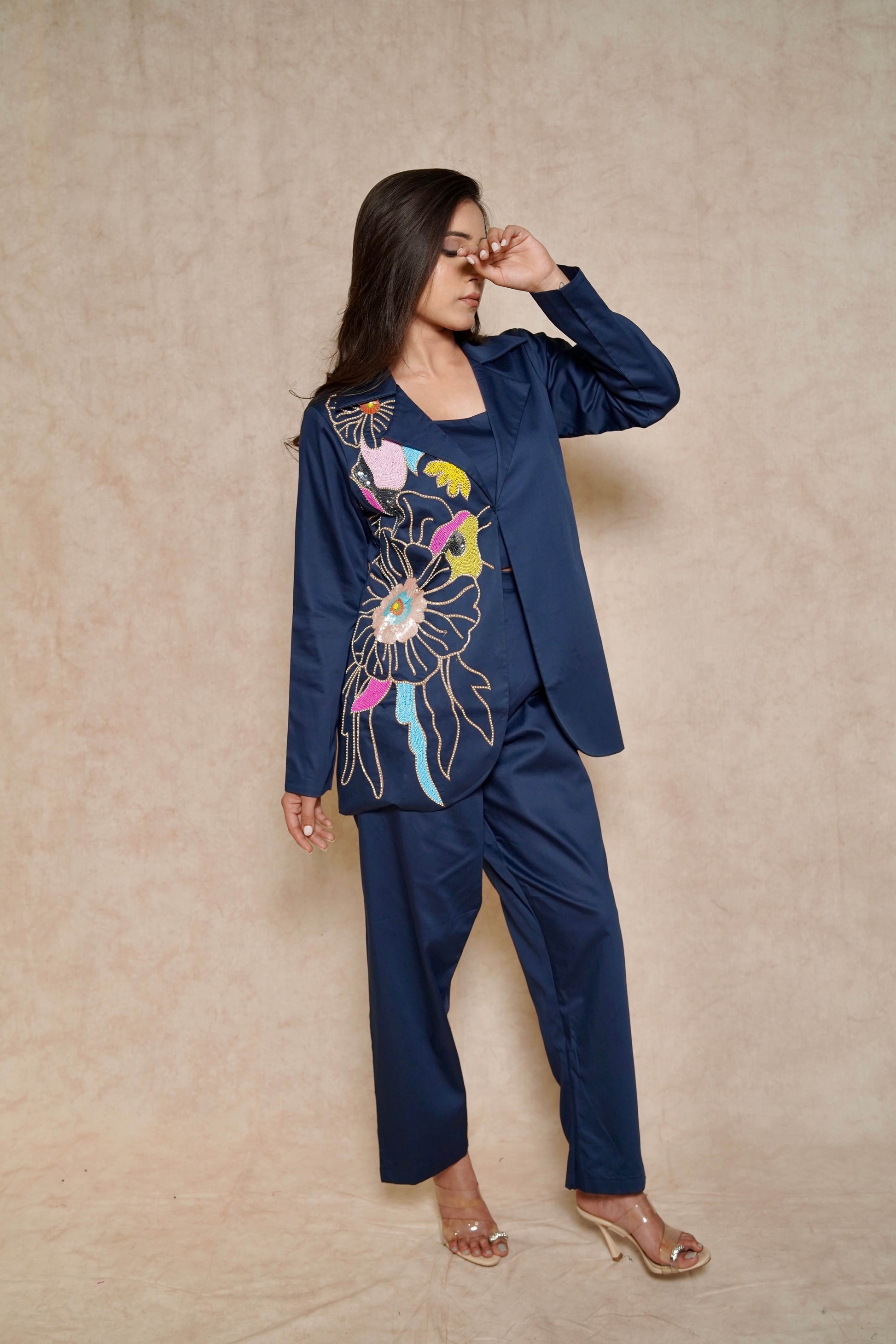 model-posing-navy-blue-pant-suit-set-with-floral-hand-work