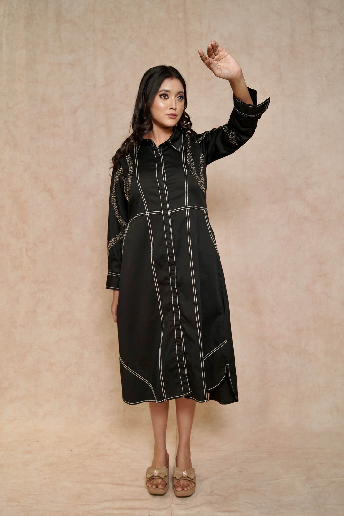 front-view-elegant-black-dress-contrasting-stitch-embellished-sleeves