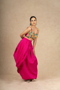 Hot Pink Indowestern set featuring a structured skirt and a crop top with multi-colored sequin and pearl embellishments, ideal for festive and wedding wear.