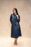 Closeup of floral embroidery on navy blue kurta
