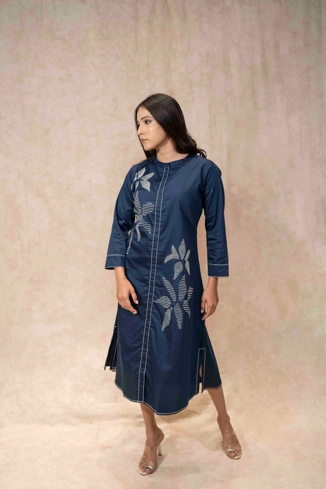 Model wearing navy blue floral embroidered kurta