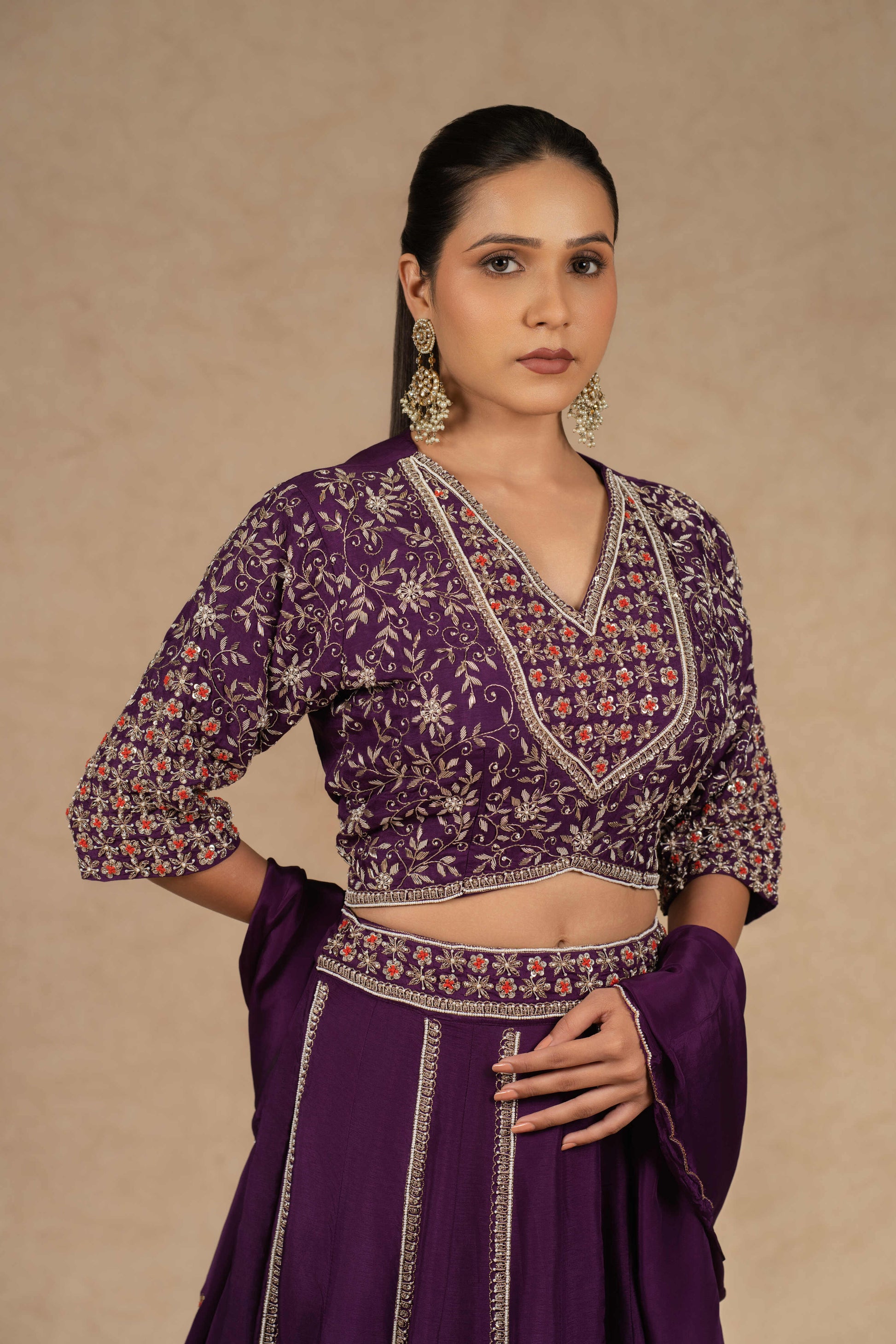 Purple silk kalidar lehenga choli with dupatta featuring intricate dabka, sequins, thread, and pearl embellishments, ideal for festive and wedding occasions.