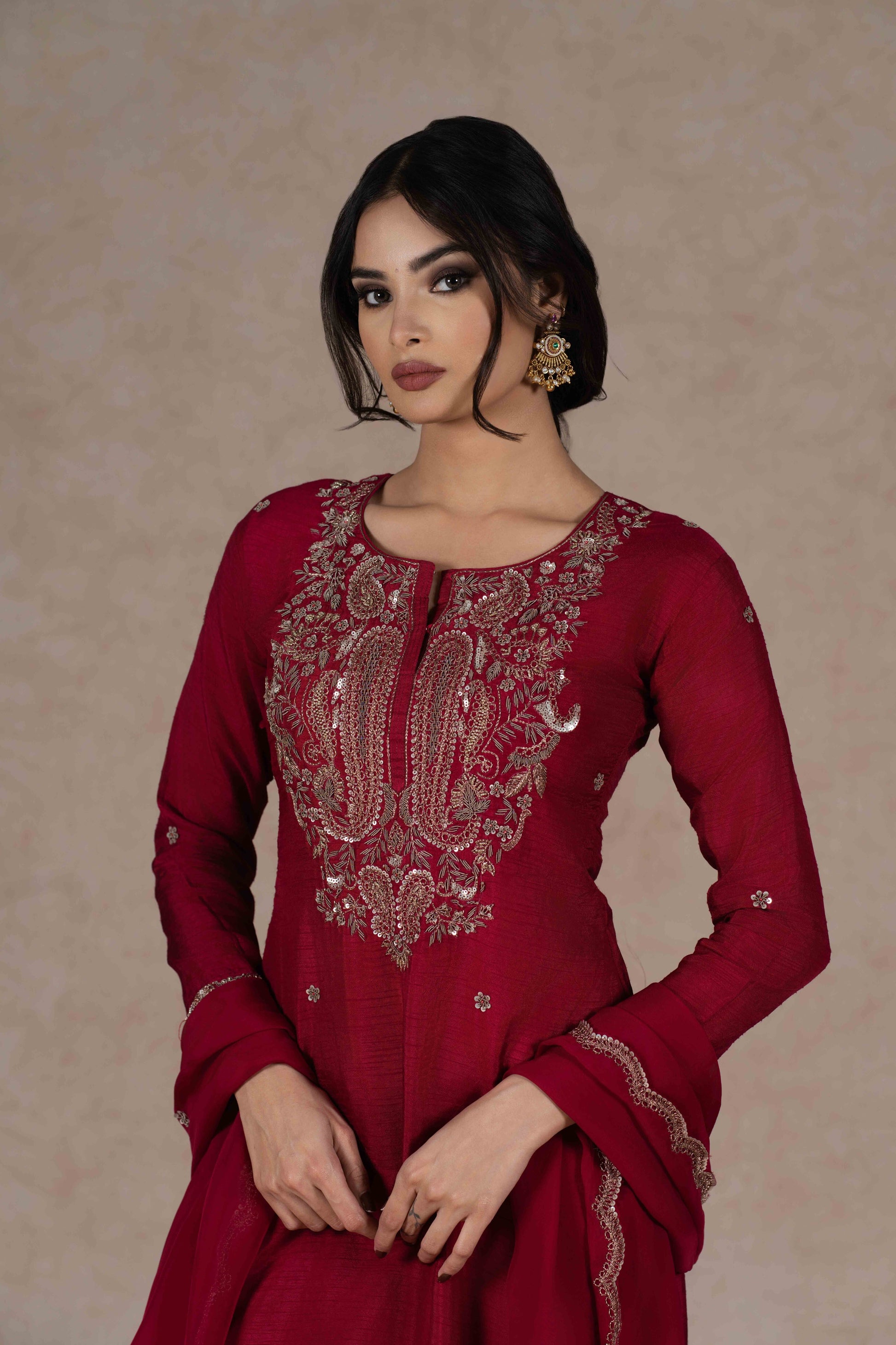 Deep red kurta and pant set with intricate zardozi embroidery, paired with an organza dupatta—perfect for festive occasions, pujas, and celebrations