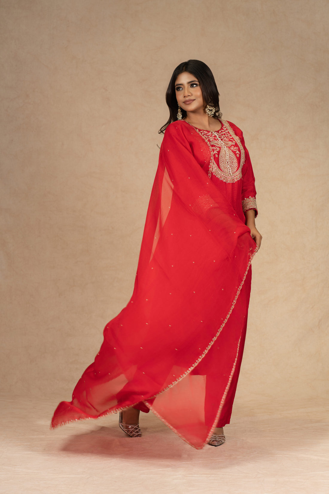 Red silk straight suit with intricate gold embroidery, featuring a matching pair of pants and an embellished organza dupatta – perfect for festive and formal occasions.