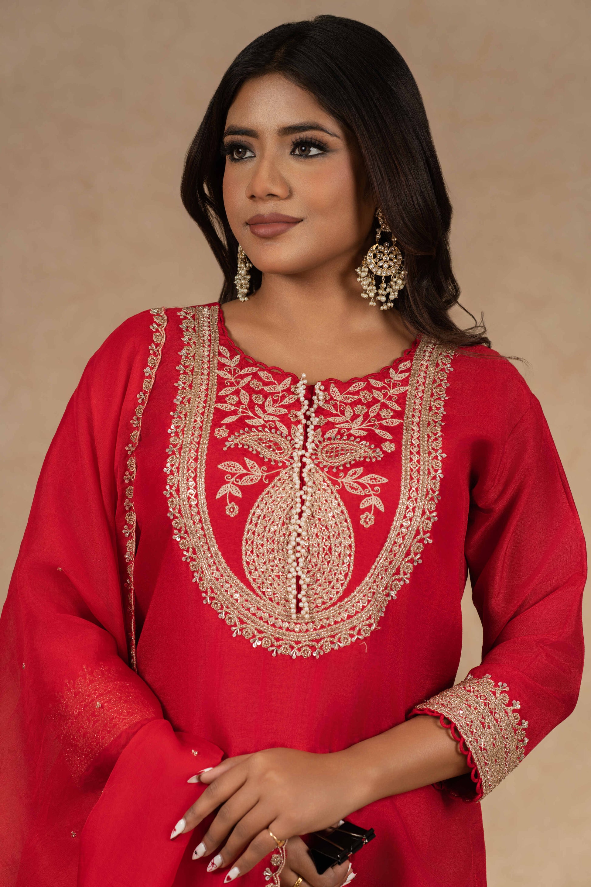 Red silk straight suit with intricate gold embroidery, featuring a matching pair of pants and an embellished organza dupatta – perfect for festive and formal occasions.