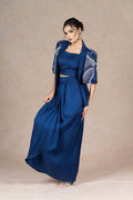 Royal blue embroidered jacket with cape sleeves, sweetheart neckline bustier, and pleated floor-length skirt. Elegant festive or formal ensemble.