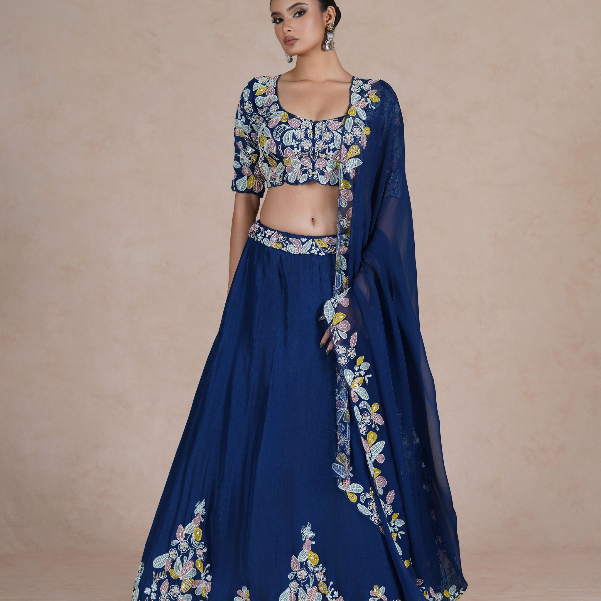 Elegant pose in Royal Blue Lehenga Choli with sequins, applique work, pearls, kasab & thread embellishments