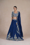 Elegant pose in Royal Blue Lehenga Choli with sequins, applique work, pearls, kasab & thread embellishments