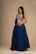 Stunning royal blue lehenga choli set with floral embroidery, perfect for wedding occasions.