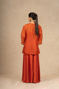 Back view of the Rust Organza Indo-Western outfit, highlighting the smooth drape and elegant finish of the fabric.