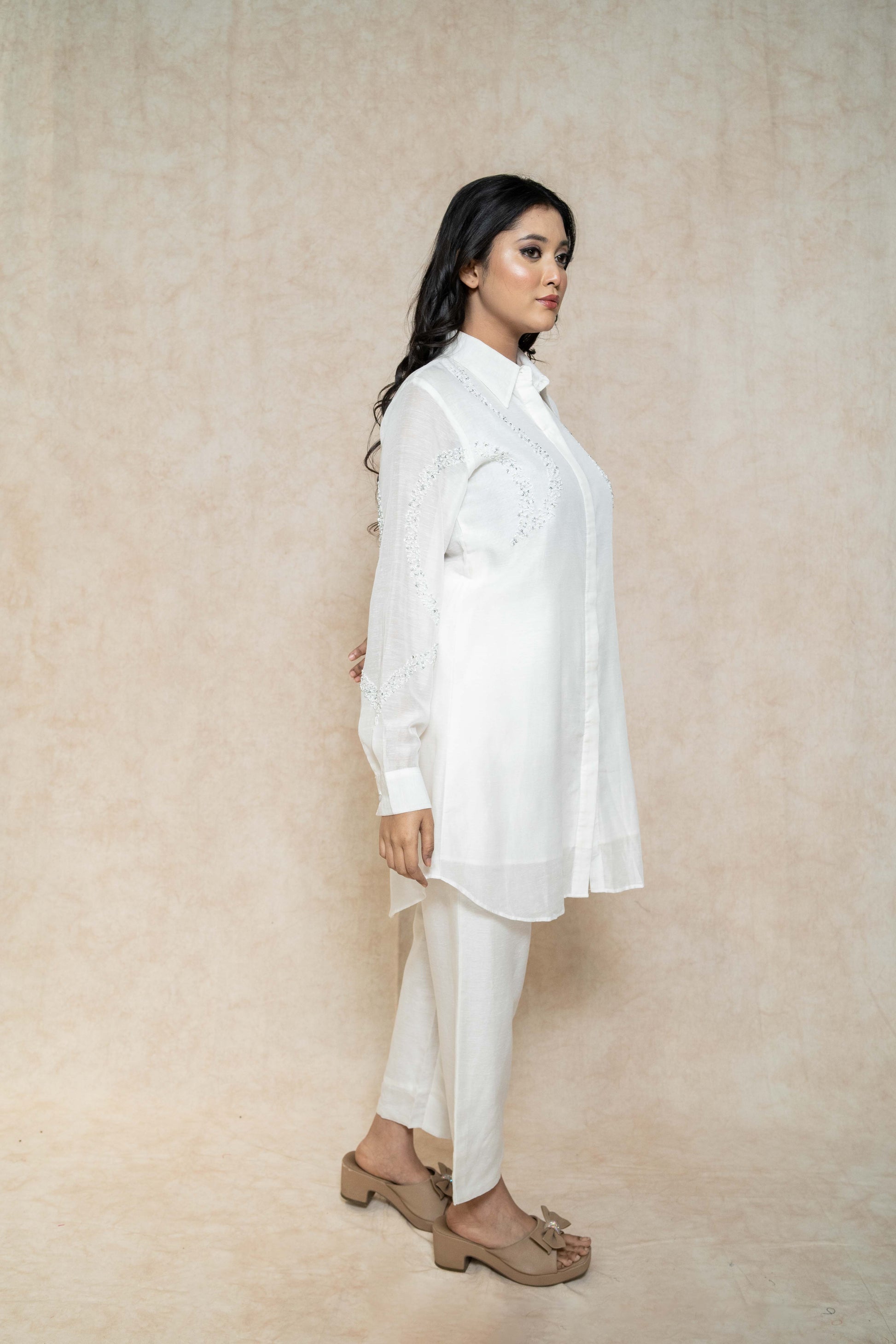 side-view-white-kurta-set-for-women-with-beadwork