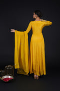 Model showcasing the flowing elegance of the Yellow Kalidar Anarkali Suit, emphasizing the luxurious fabric and craftsmanship.